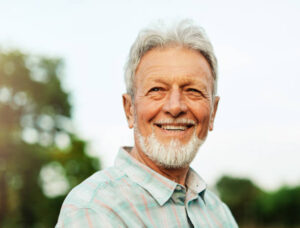 About portrait of an elderly man outdoors. happy senior man in park